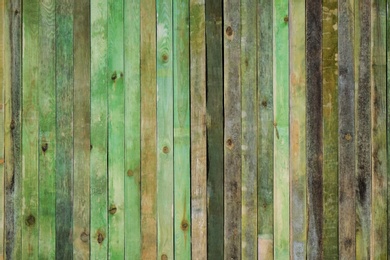 Photo of Green wooden surface as background, closeup view