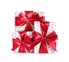 Photo of Beautifully wrapped gift boxes on white background