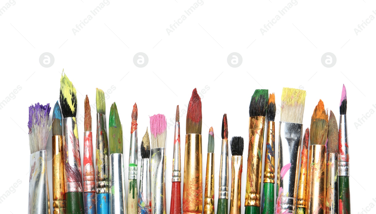 Photo of Different paint brushes on white background, top view