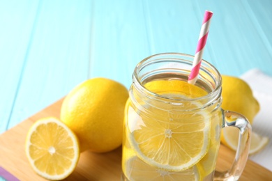 Photo of Mason jar with lemon water, closeup