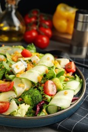 Delicious salad with lentils, vegetables and cheese on table