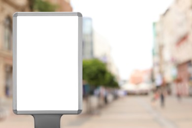 Blank advertising board on city street. Space for text