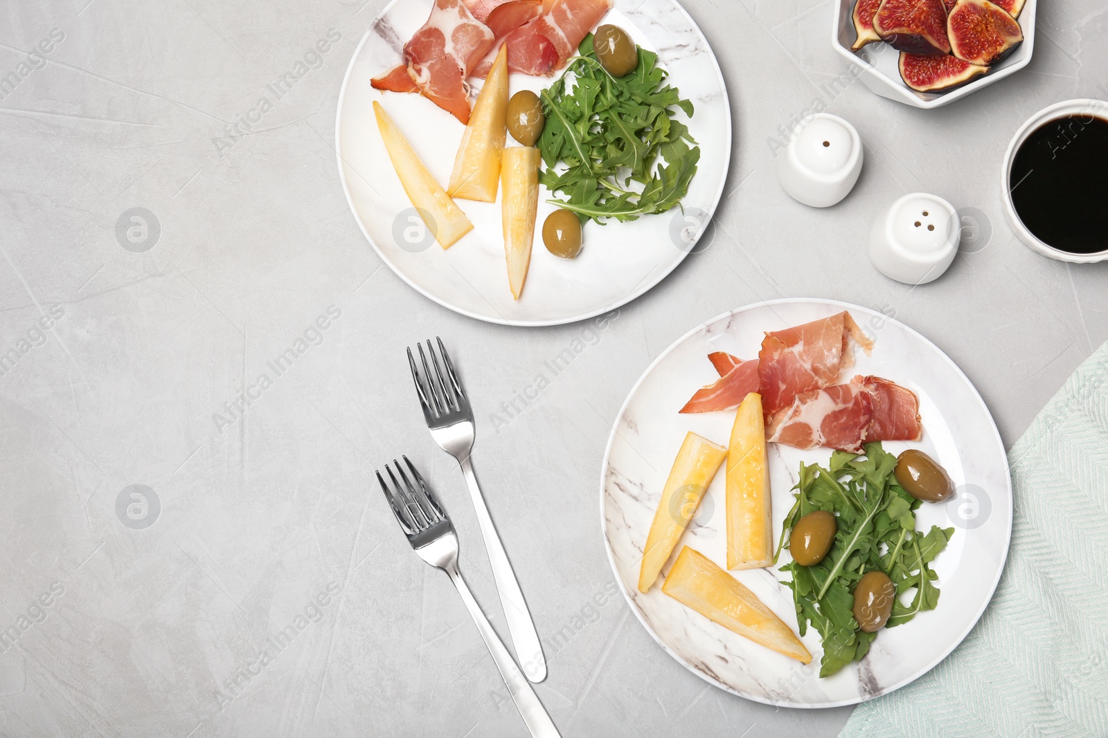 Photo of Flat lay composition with melon appetizer served on table. Space for text