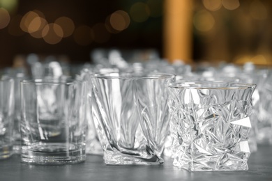 Empty glasses on table against blurred background