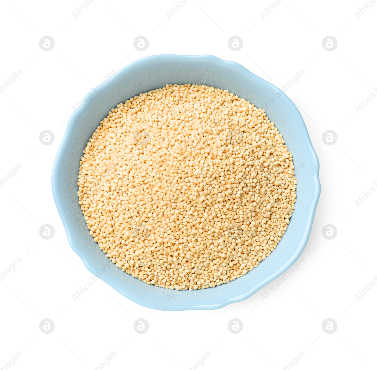 Photo of Raw quinoa in light blue bowl isolated on white, top view