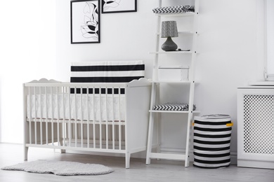 Baby bedroom interior with crib and beautiful decor elements