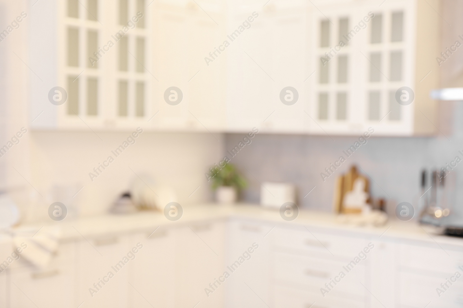 Photo of Blurred view of modern kitchen. Interior design