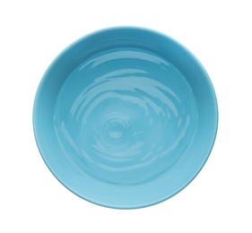 Blue ceramic bowl with clear water isolated on white, top view
