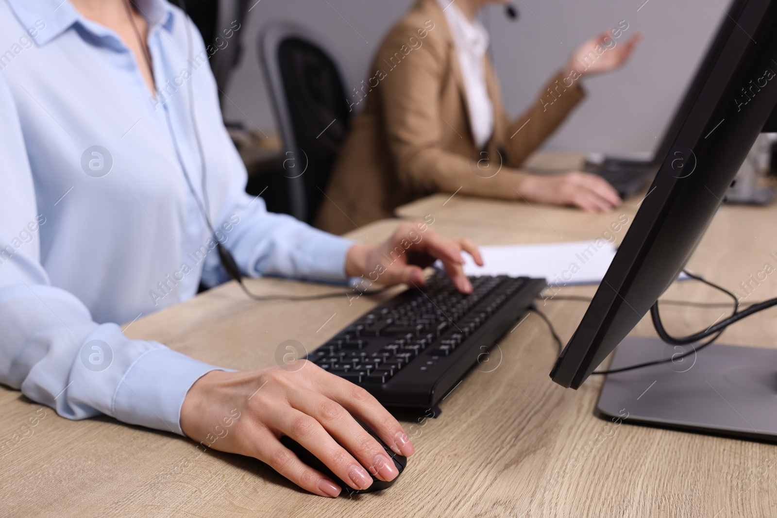 Photo of Call center operator working in office, closeup