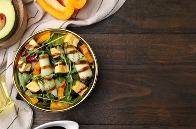 Delicious salad with tofu, vegetables and balsamic vinegar served on wooden table, flat lay. Space for text