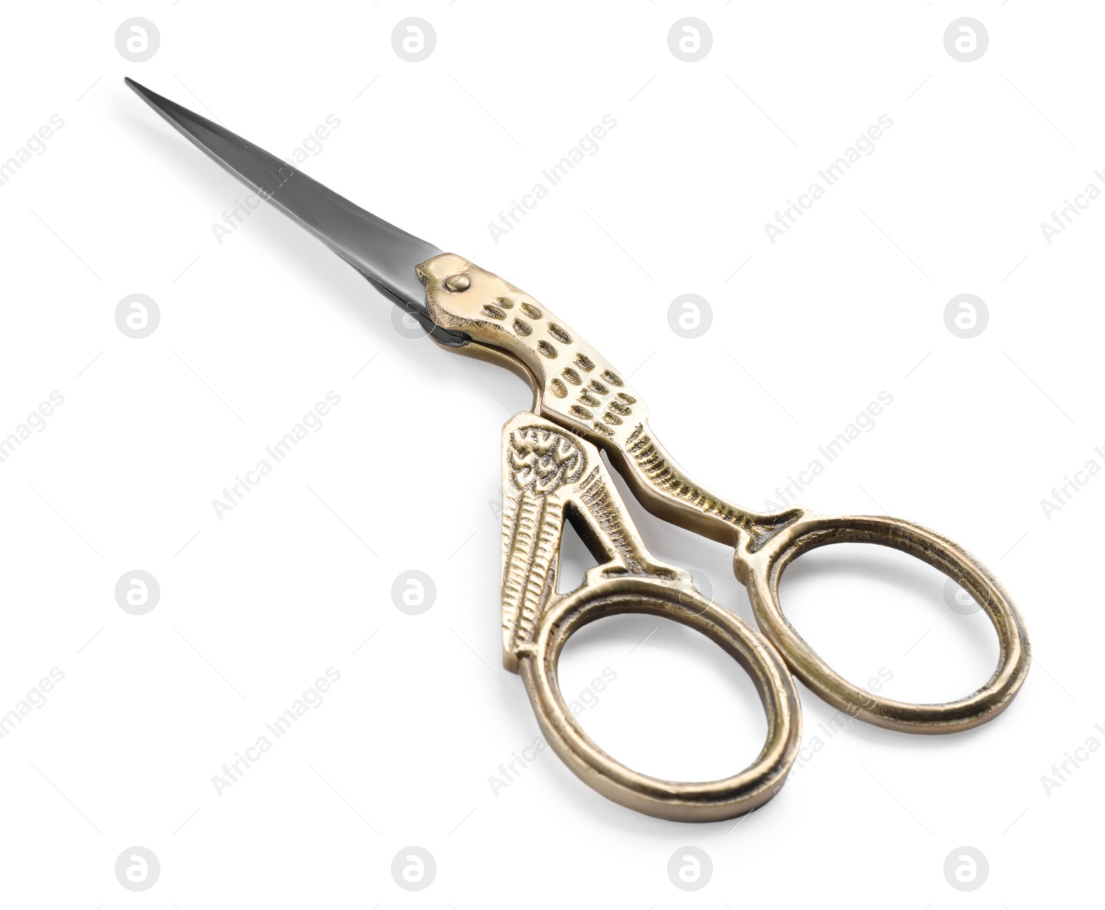 Photo of Pair of scissors with ornate handles isolated on white