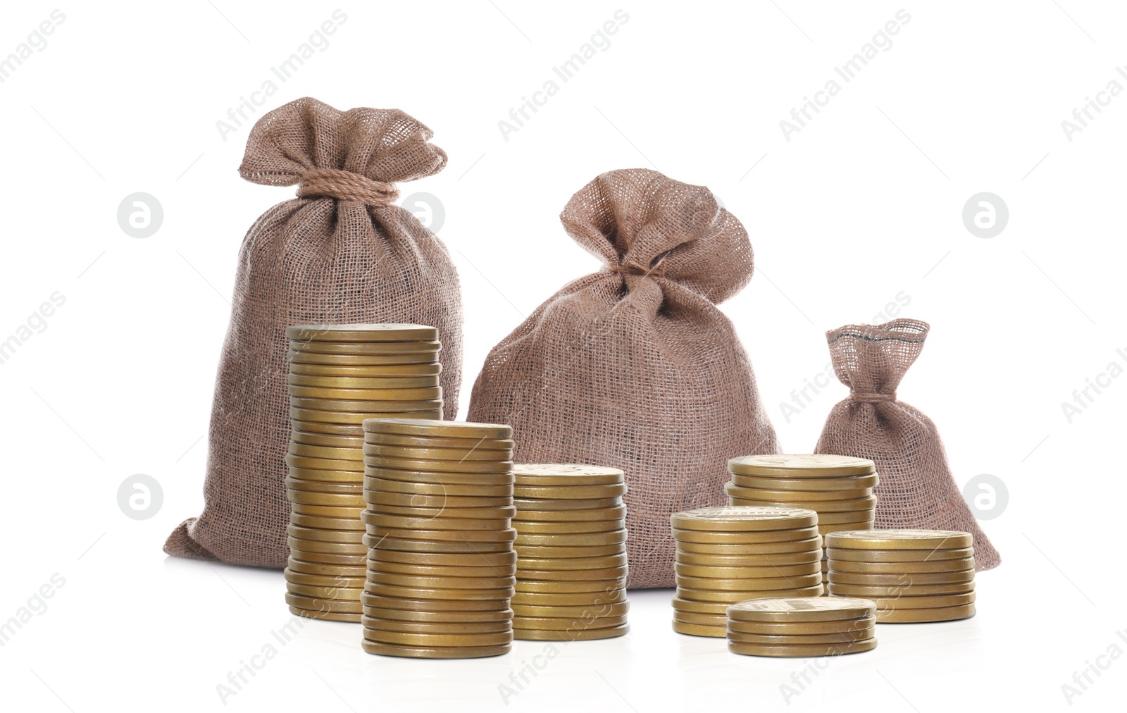 Image of Stacked coins and sack full of money on white background