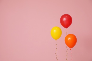 Photo of Bright balloons on color background, space for text. Celebration time