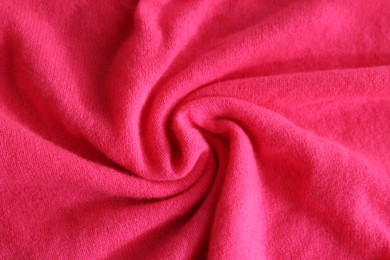 Photo of Beautiful pink fabric as background, top view