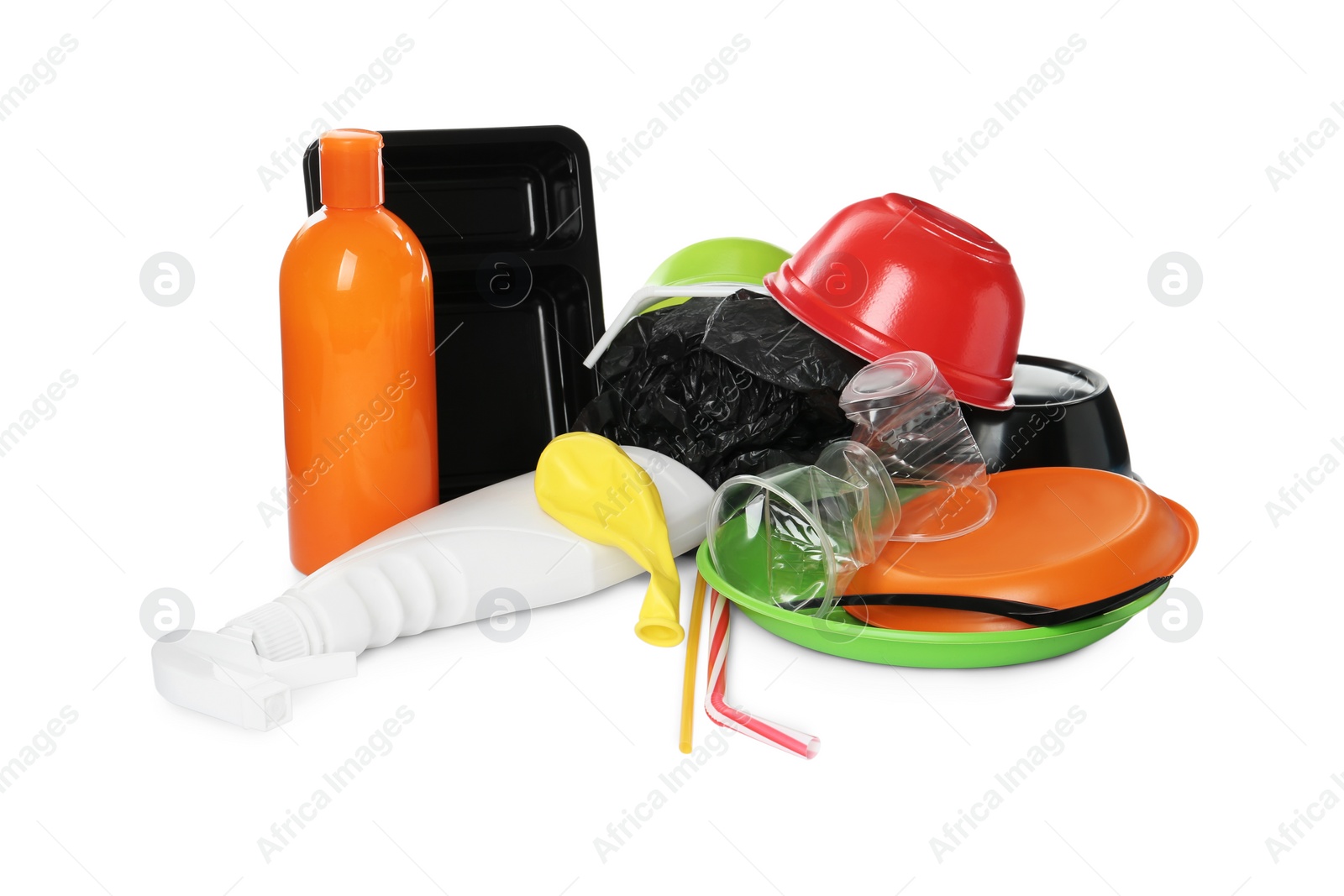 Photo of Pile of different plastic items on white background