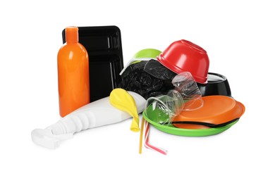 Pile of different plastic items on white background