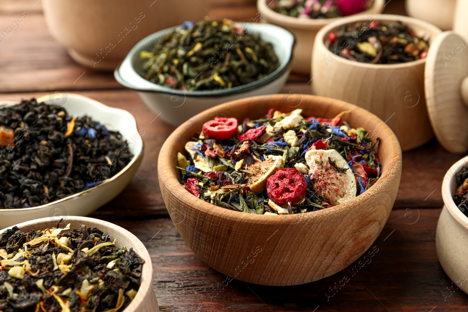 Photo of Many different herbal teas on wooden table