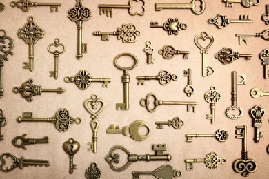 Photo of Old vintage keys on craft paper, flat lay