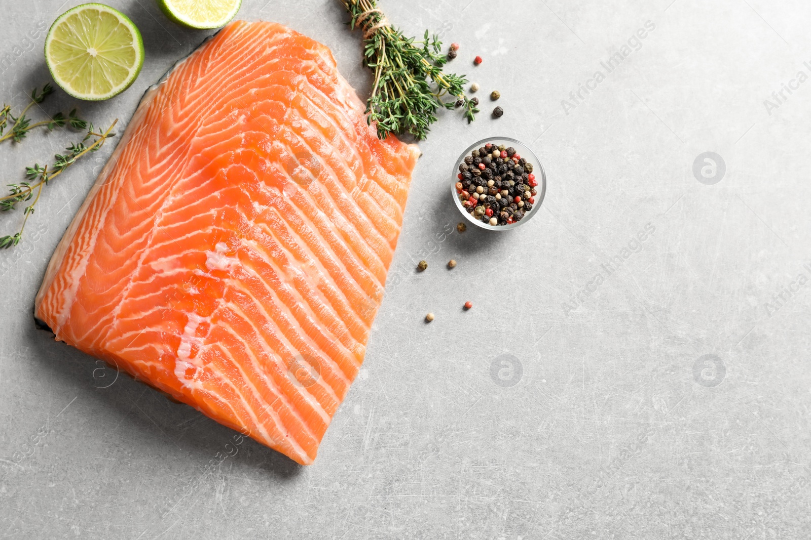 Photo of Raw salmon fillet and ingredients for marinade on table, top view