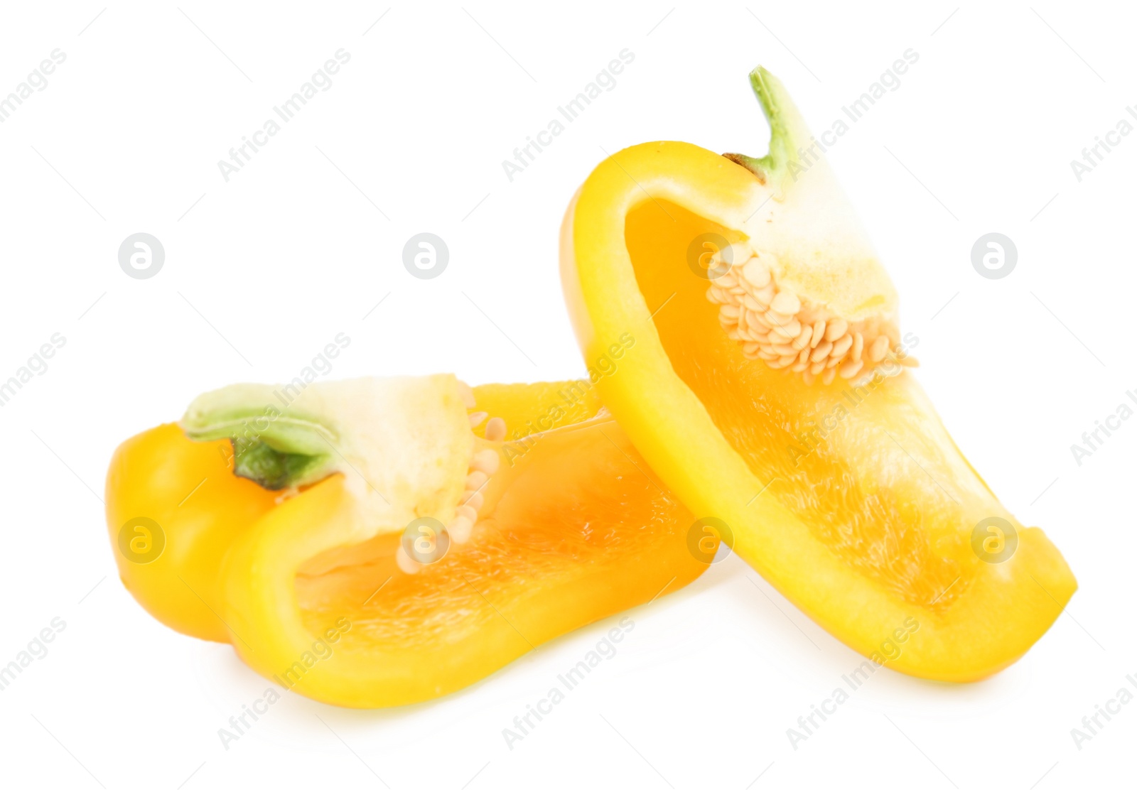 Photo of Cut yellow bell pepper with seeds isolated on white