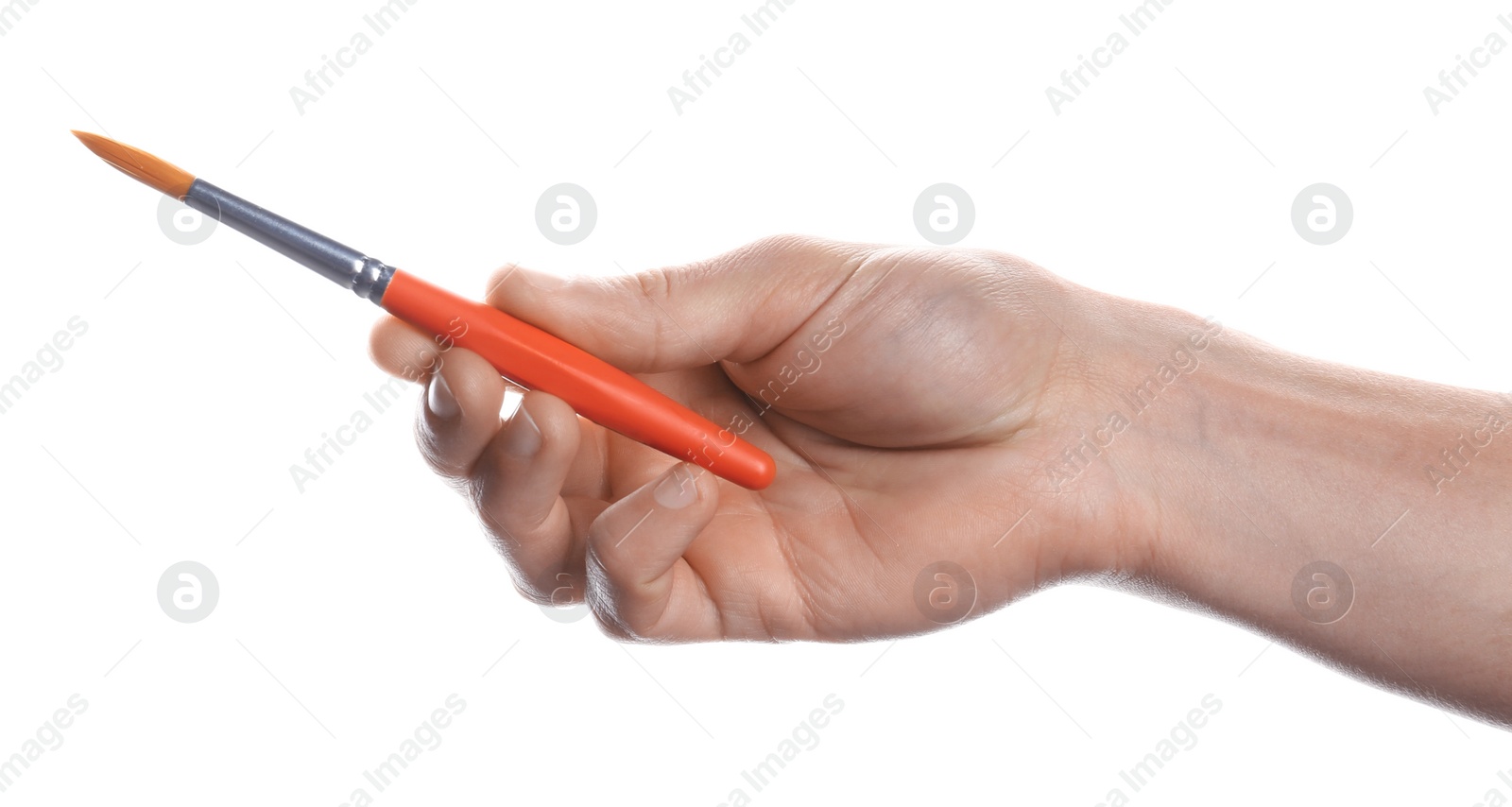 Photo of Man holding paint brush on white background, closeup