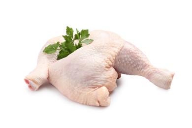 Photo of Raw chicken leg quarters with parsley on white background