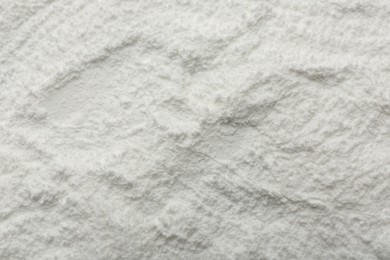 Photo of Texture of baking powder as background, top view