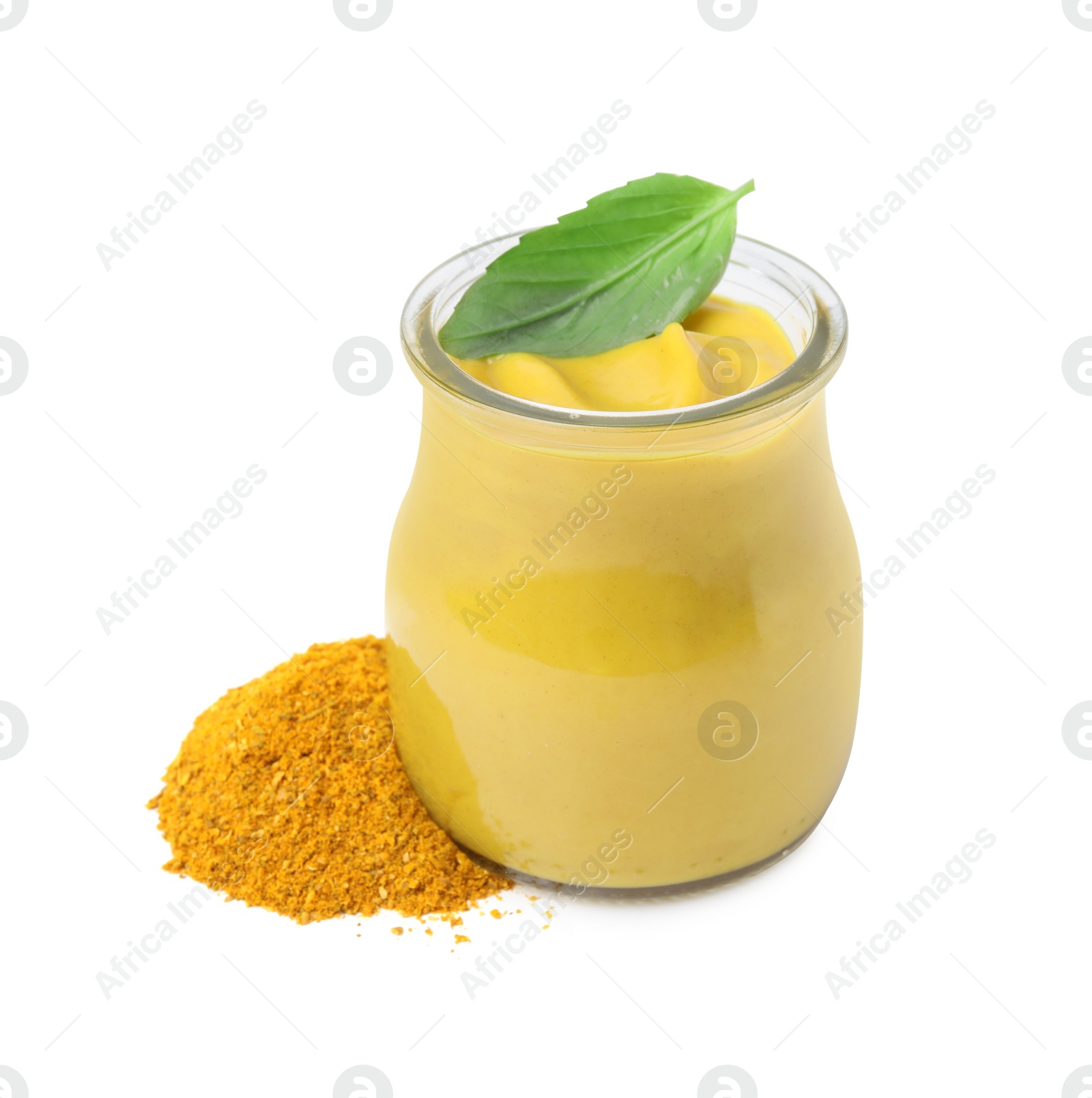 Photo of Jar with tasty curry sauce, powder and basil leaf isolated on white