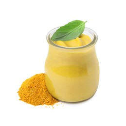 Jar with tasty curry sauce, powder and basil leaf isolated on white