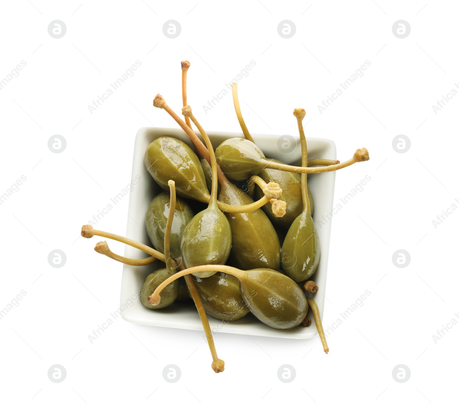 Photo of Capers in bowl isolated on white, top view