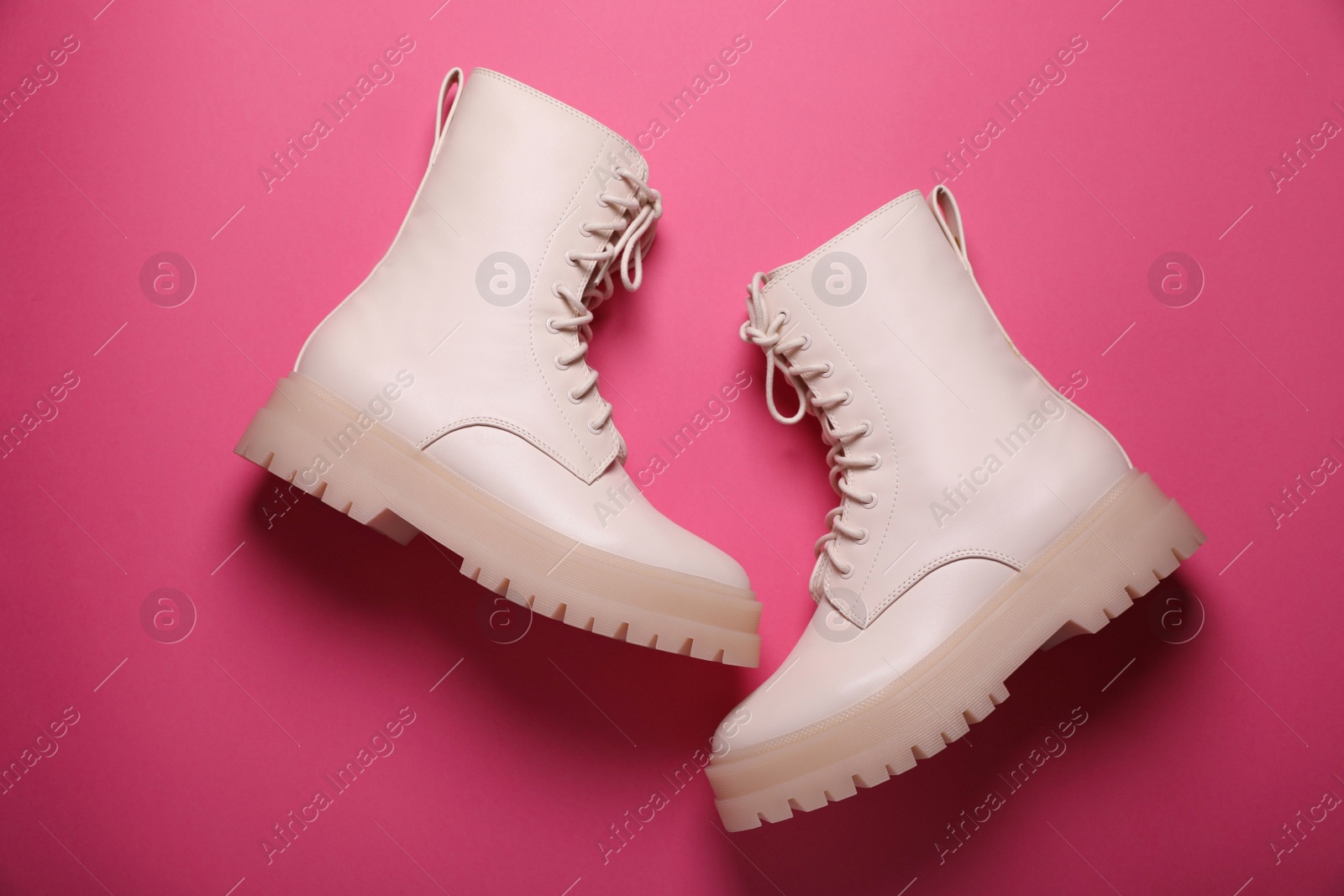 Photo of Pair of stylish leather shoes on pink background, flat lay