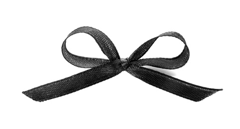 Photo of Black ribbon on white background. Funeral symbol