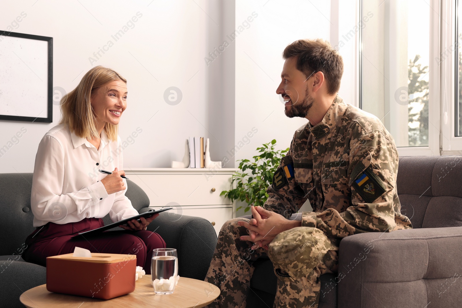 Photo of Psychologist working with military officer in office