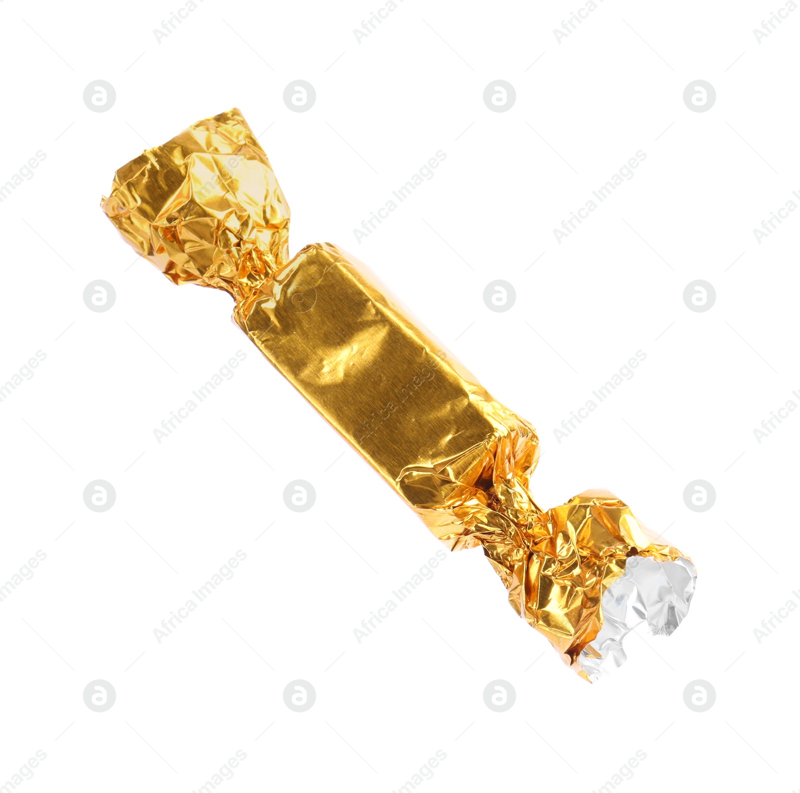 Photo of Tasty candy in golden wrapper isolated on white