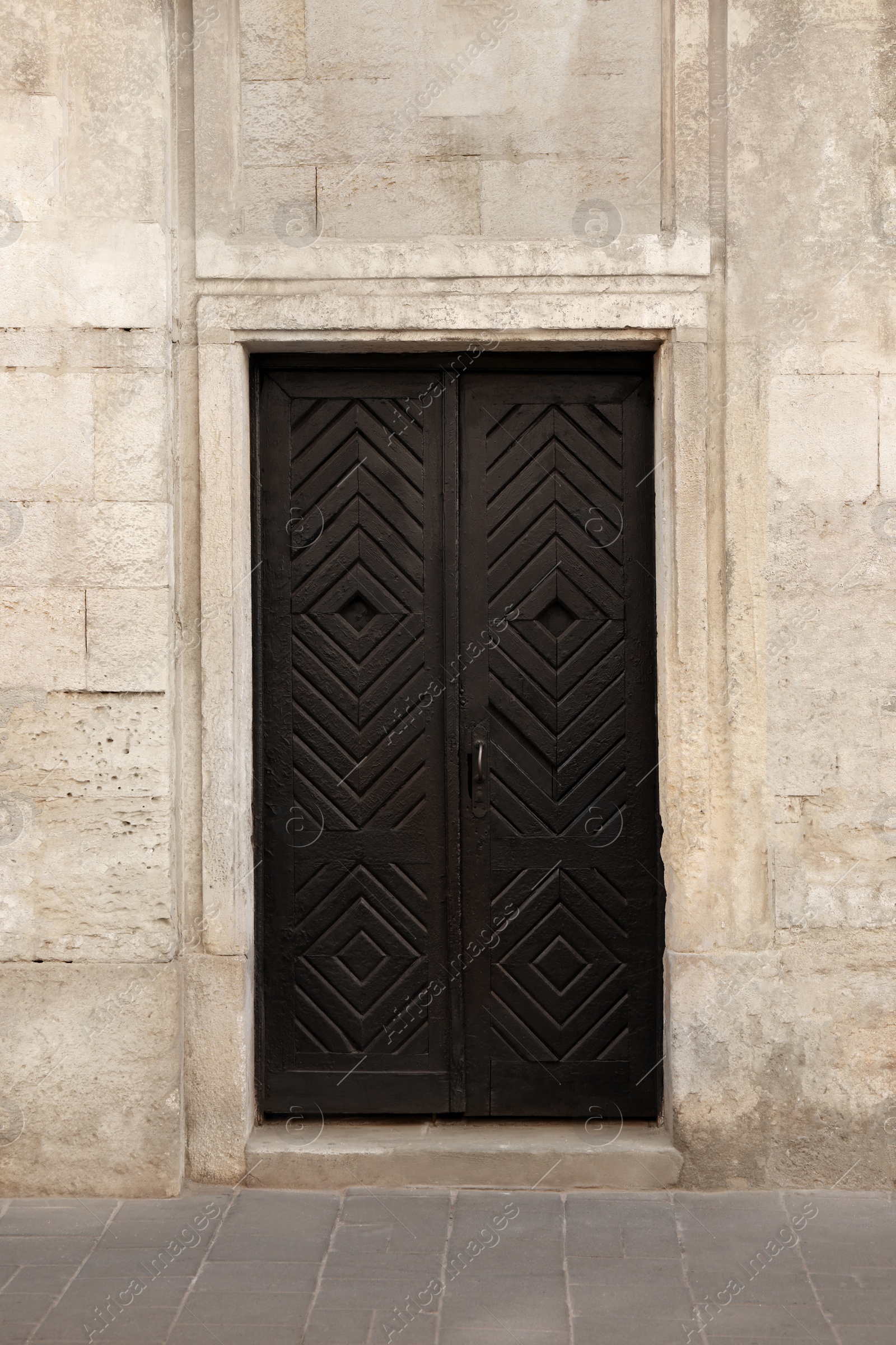 Photo of View of building with vintage wooden door. Exterior design