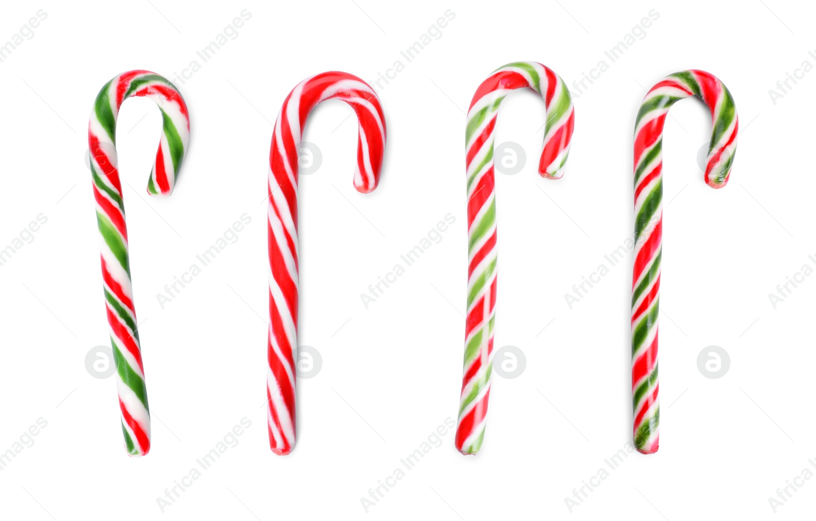 Image of Set with yummy sweet Christmas candy canes on white background 