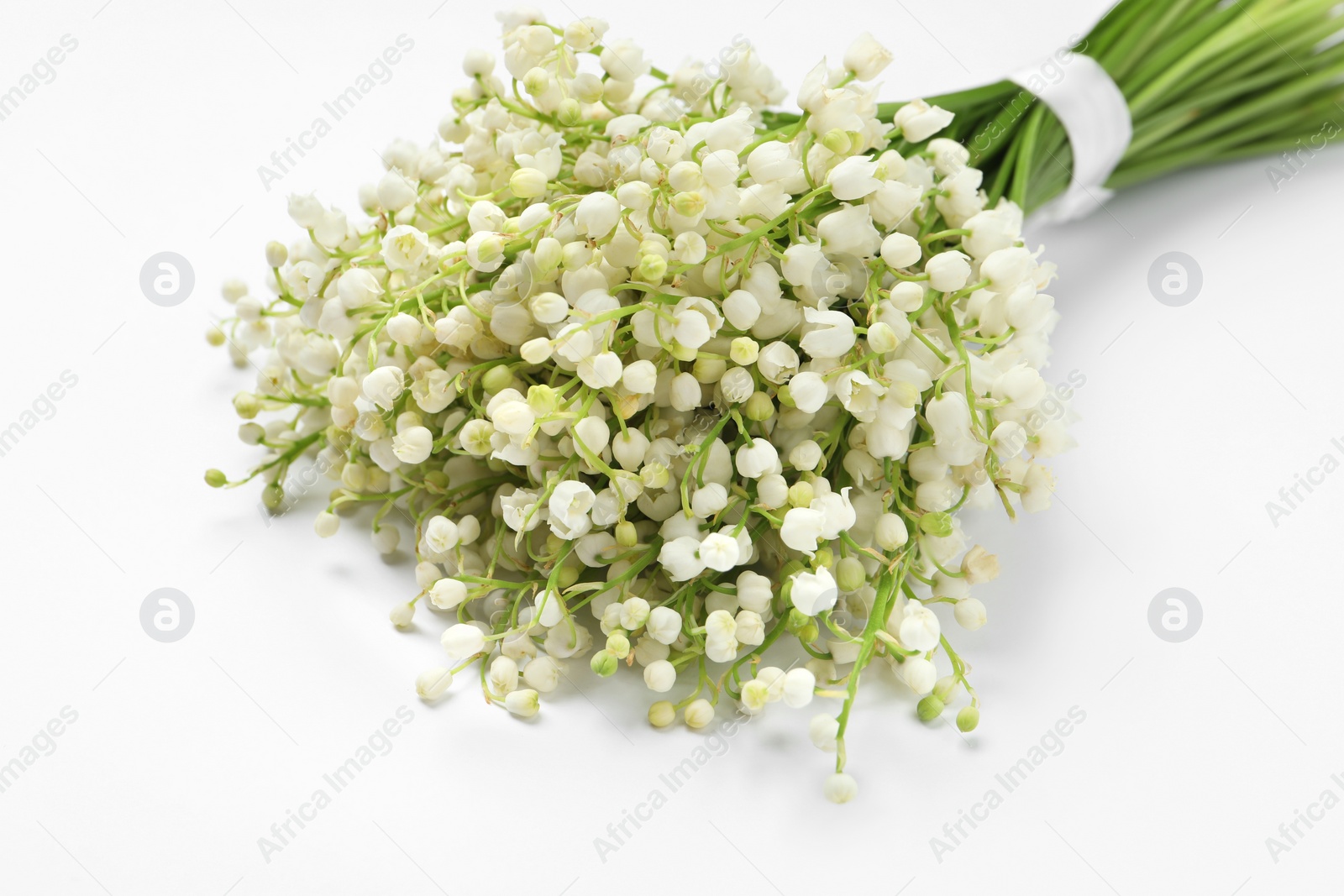 Photo of Beautiful lily of the valley bouquet on white background, closeup