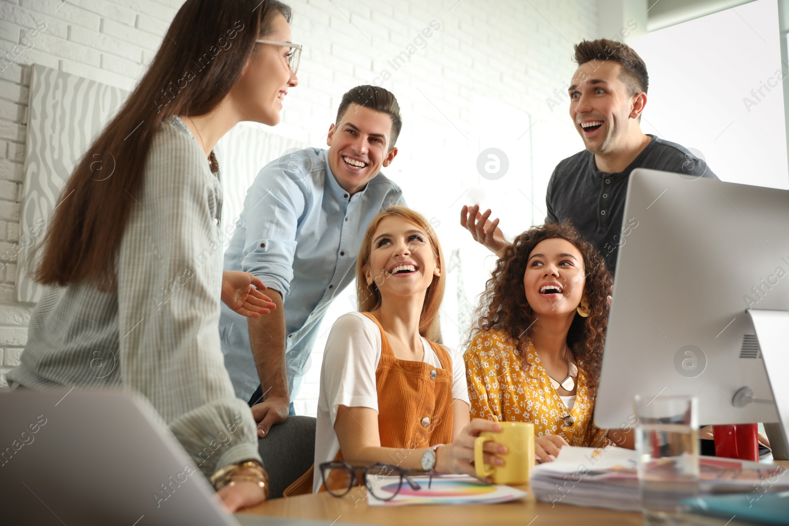 Photo of Team of professional designers working in office