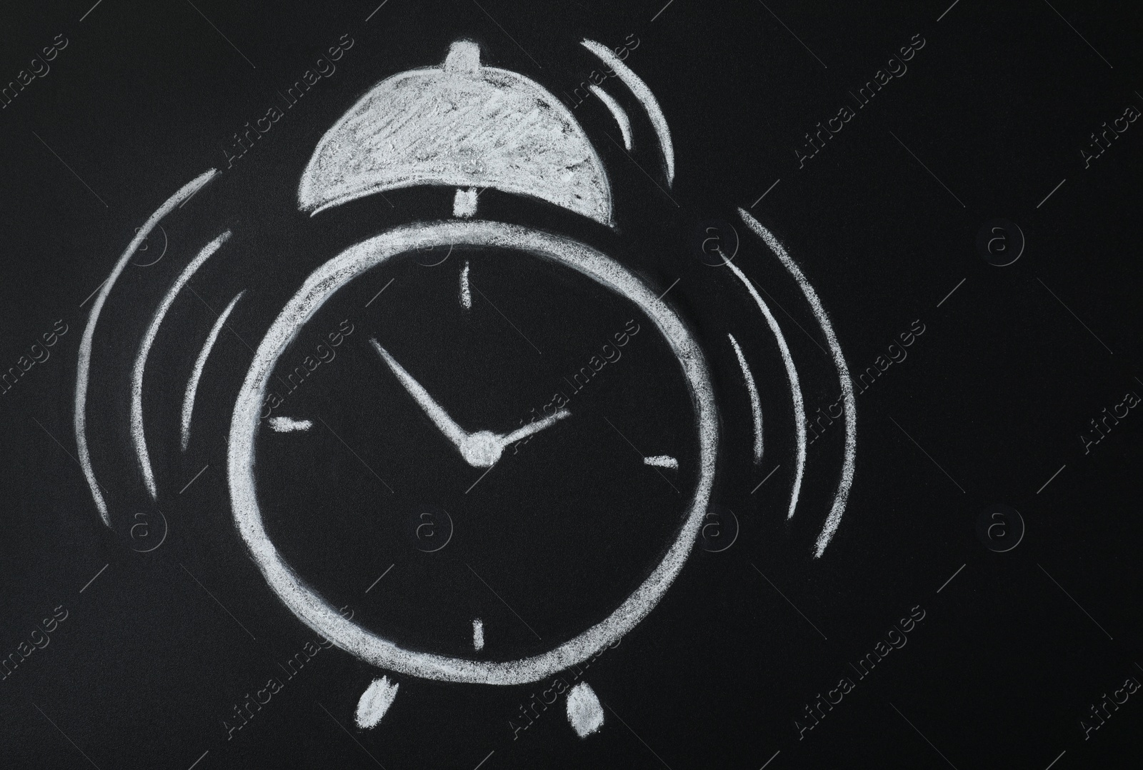 Photo of Alarm clock drawn on blackboard. School time