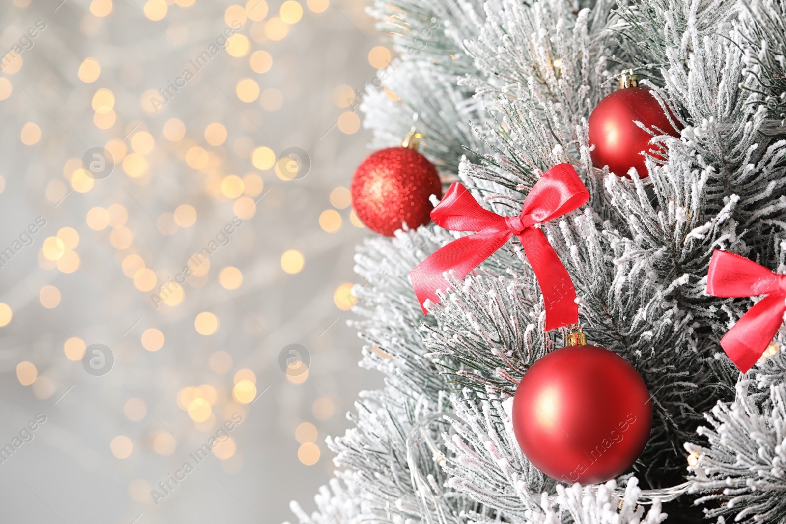 Photo of Beautiful Christmas tree with decor against blurred lights on background. Space for text