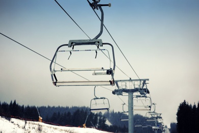 Empty chairlift at ski resort. Winter vacation