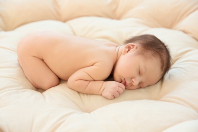 Photo of Adorable newborn baby sleeping on bed