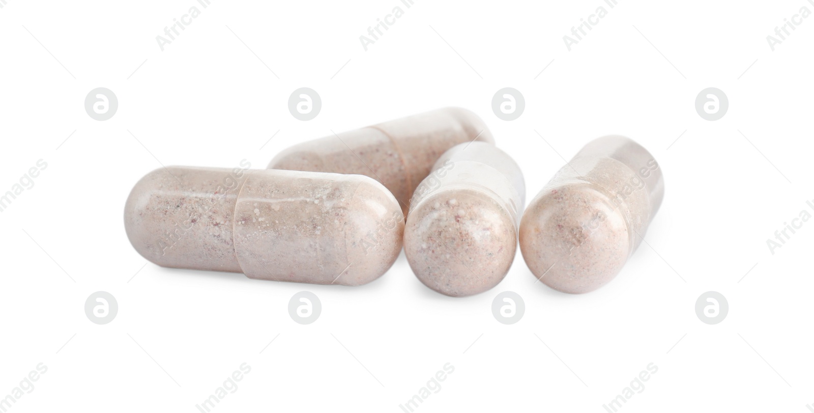 Photo of Many transparent gelatin capsules on white background, closeup