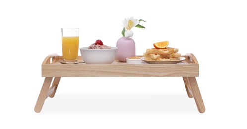 Wooden tray with delicious breakfast and beautiful flower on white background