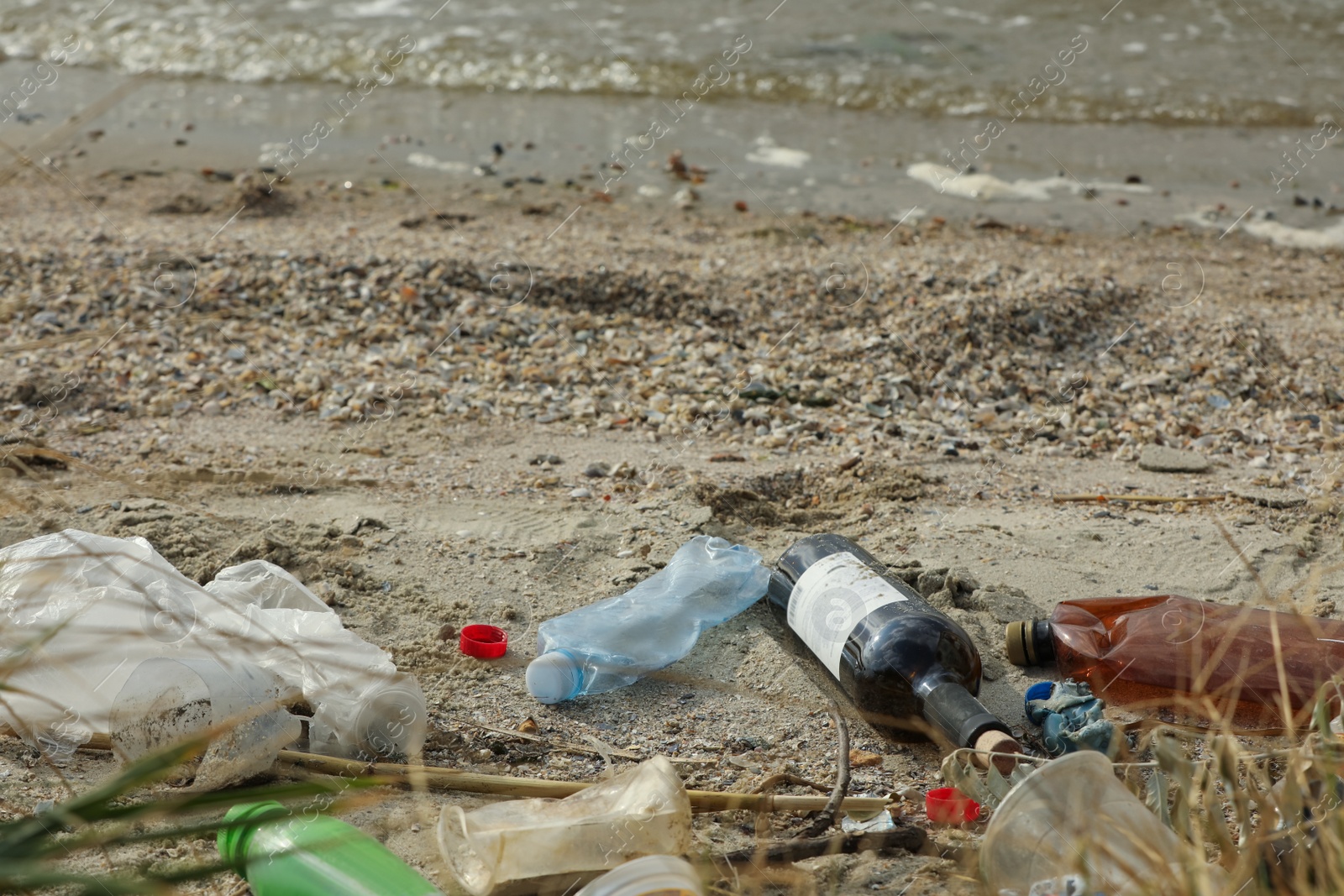 Photo of Garbage scattered on beach. Environment pollution problem