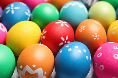 Colorful Easter eggs with different patterns as background, closeup