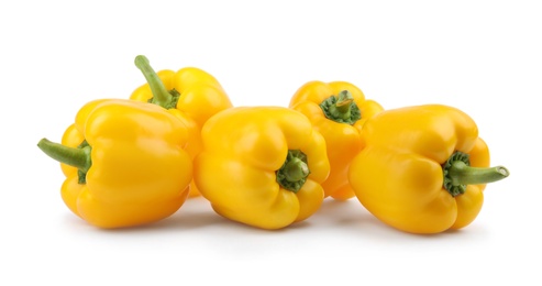 Photo of Ripe yellow bell peppers isolated on white