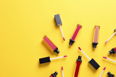 Photo of Composition of lipsticks on color background, flat lay. Space for text