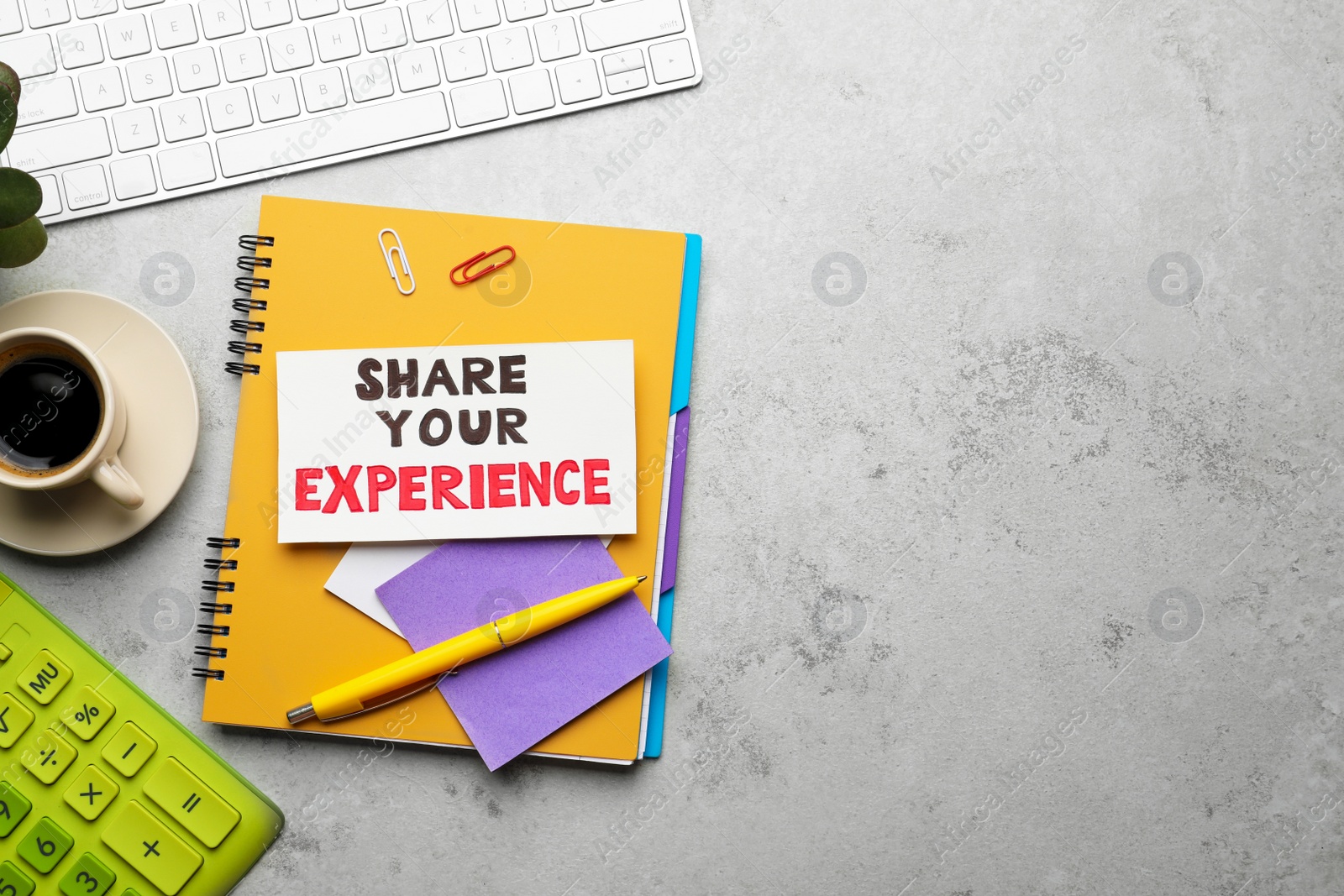 Photo of Share Your Experience. Flat lay composition with card, stationery and coffee on light table, space for text