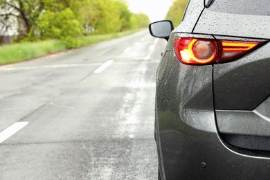 Car parked outdoors on rainy day, closeup